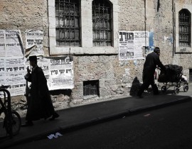 Ultra-Orthodox Jews walk in the Ultra-Orthodox neighborhood of Mea Shearim of Jerusalem on Sept. 13, 2017.