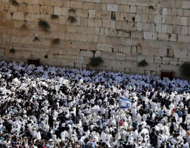 Jewish men, wearing traditional Jewish prayer shawls known as Tallit, perform the annual Cohanim prayer (priest's blessing) during the Sukkot holiday, or the feast of the Tabernacles, at the Western Wall in the old city of Jerusalem on Oct. 8, 2