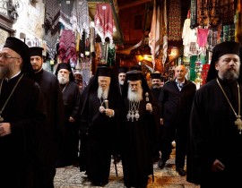 Greek Orthodox Patriarch of Jerusalem Theophilos III, center right, and Ecumenical Patriarch of Constantinople Bartholomew I make their way to the Church of the Holy Sepulchre in Jerusalem's Old City on Dec. 5, 2017.