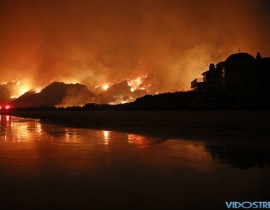 A wildfire burns along the 101 Freeway on Tuesday, in Ventura, Calif.