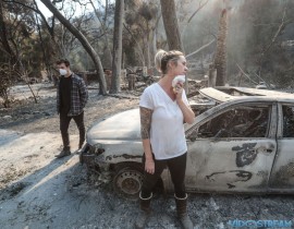 Christy Woodhams and her son Josh Lowe inspect the remains of the cabin they were staying in that belonged to her cousin on Dec. 7, 2017 at Camp Bartlett, in Santa Paula, Calif.  Richard Lui,