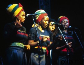 Bob Marley and the I-Threes (Judy Mowatt, Rita Marley and Marcia Griffiths) perform together at the Rainbow Theatre in London in 1977