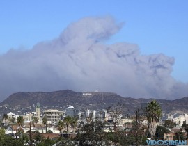 Smoke from the Creek wildfire in the San Gabriel Mountains, the second range behind the Hollywood Hills, home of the Hollywood sign, looms up over Los Angeles Tuesday morning on Dec. 5, 2017.
