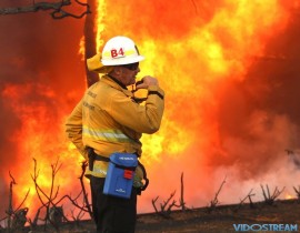 LAFD Captain Scott Quinn coordinates the attack on two fires of homes in the upscale Bel Air Estates area of Los Angeles on Dec. 6, 2017.