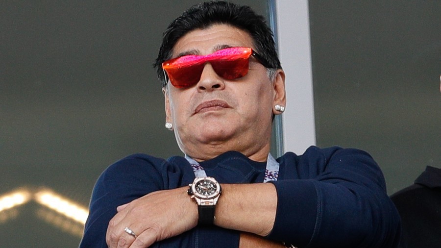 Maradona denies making racist gesture at S. Korean World Cup fans, apologizes for puffing on cigar