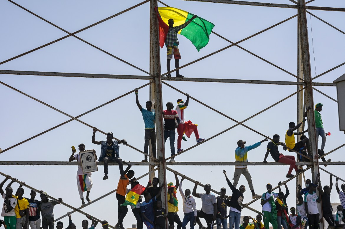 Senegalese football fans made the most of the national holiday to celebrate the title. [Sylvain Cherkaoui/AP Photo]